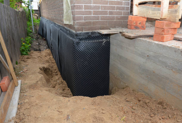 Happy homeowners after waterproofing job in Ligonier